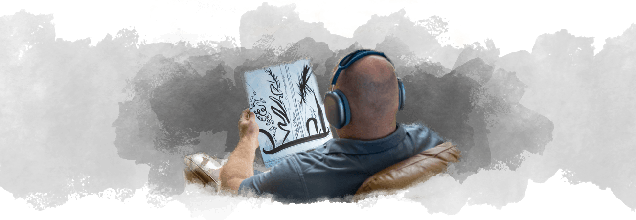 Calvin sitting with headphones, channeling art